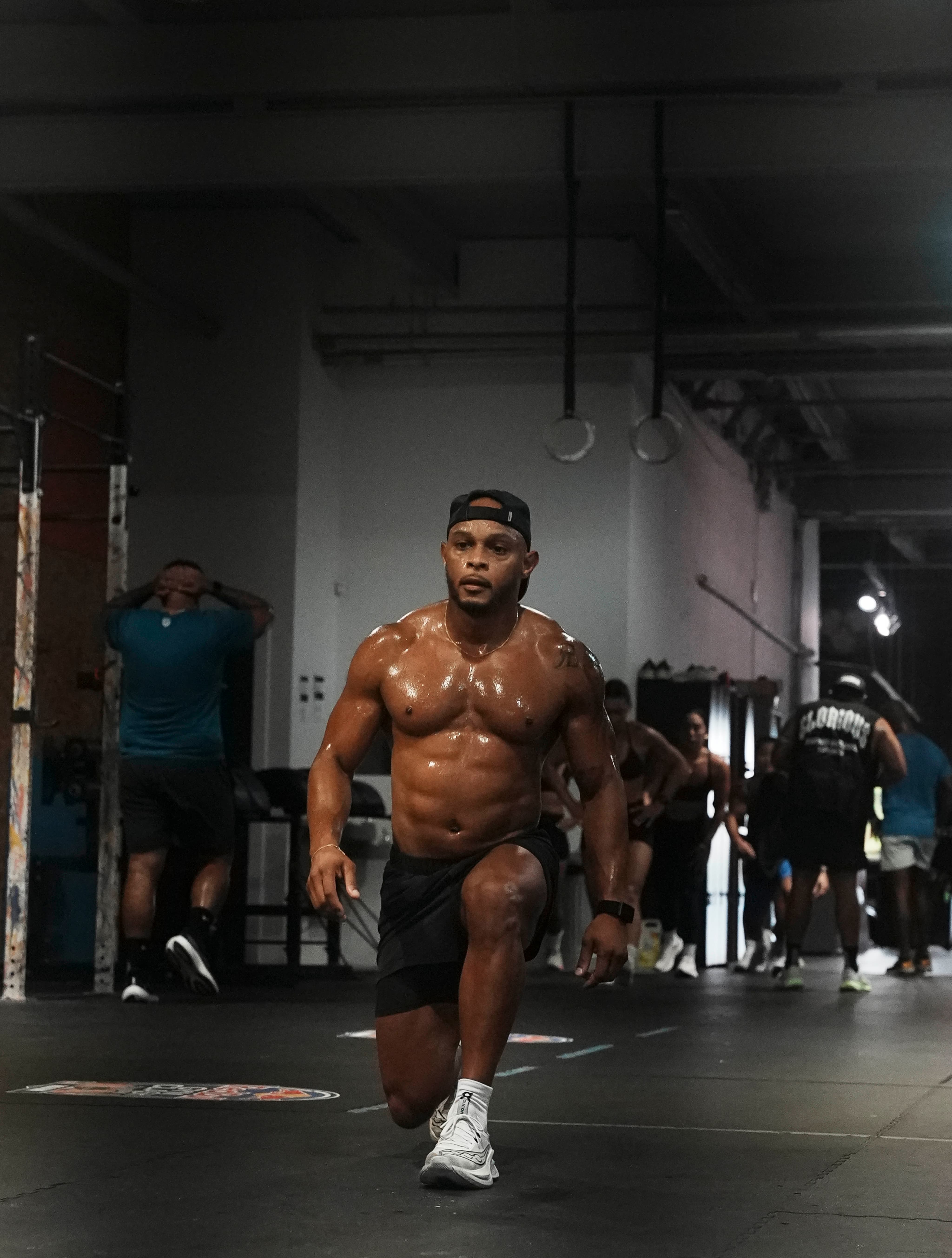 Coach JT mid-lunge — the work travels
